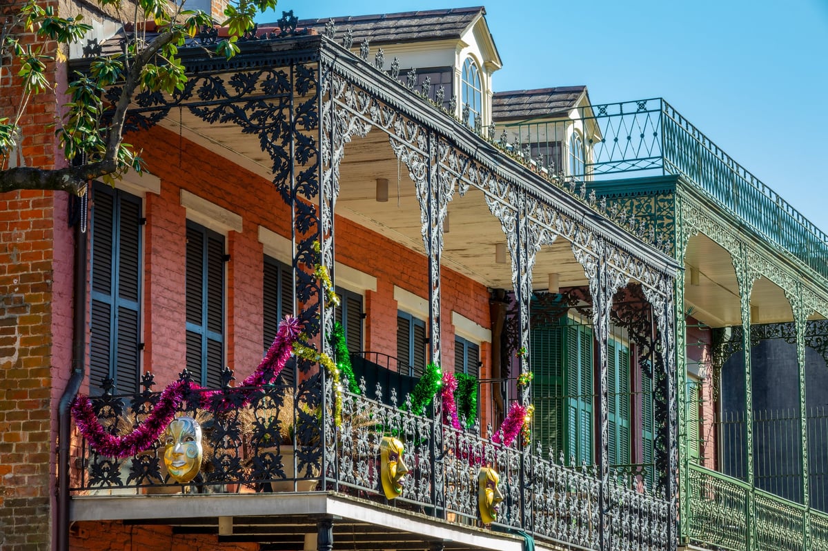 Balconies with intricate ironwork on a street in the French Quarter, New Orleans architecture, Louisiana