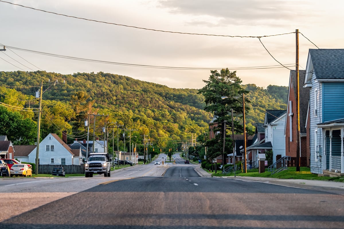Downtown area south Delphine avenue empty residential road street in small town in Virginia with sunset and houses