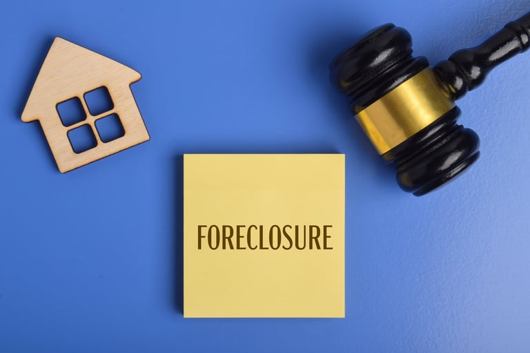 Foreclosure auction gavel and house